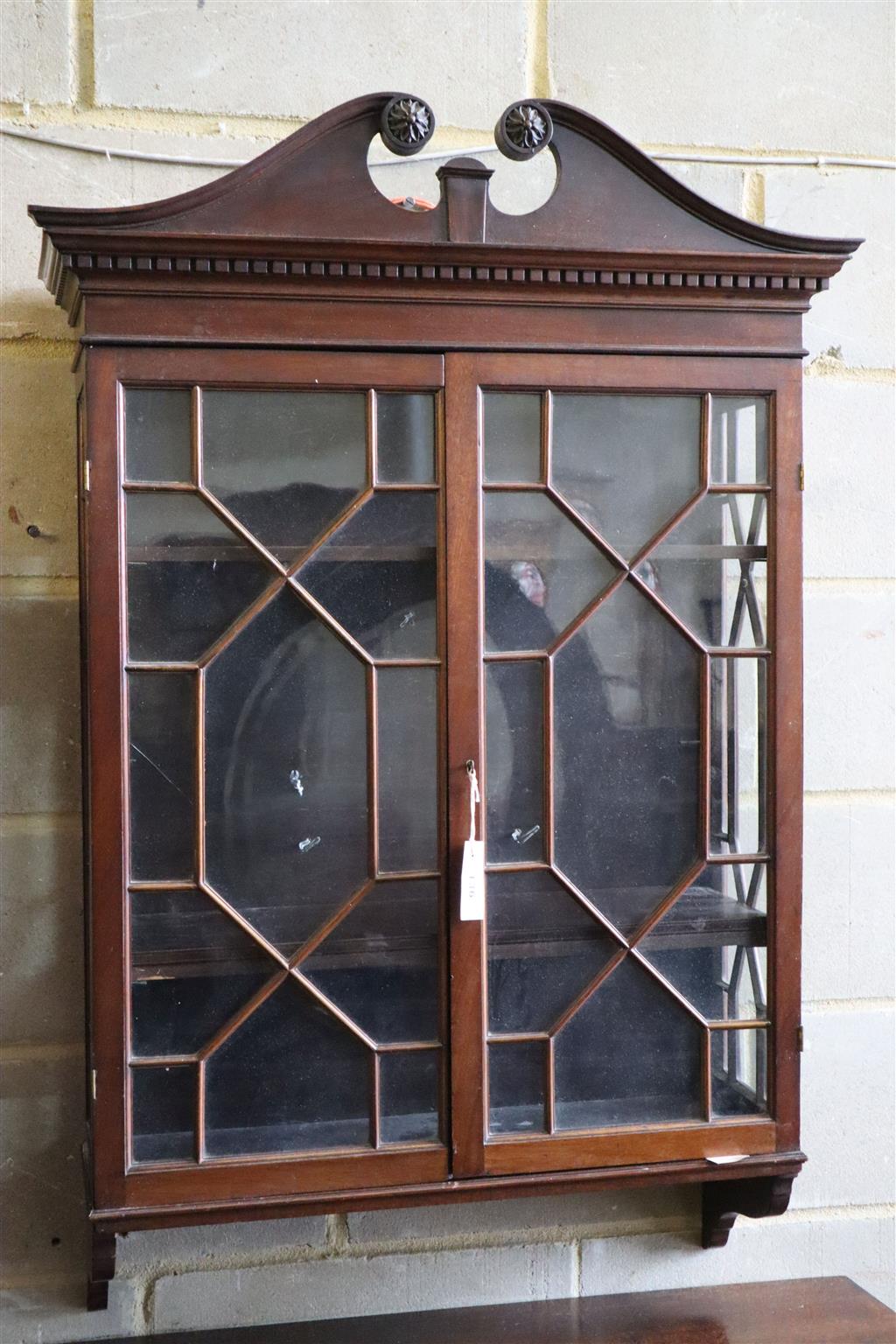 A George III style mahogany two door hanging glazed cabinet, width 70cm, depth 22cm, height 115cm